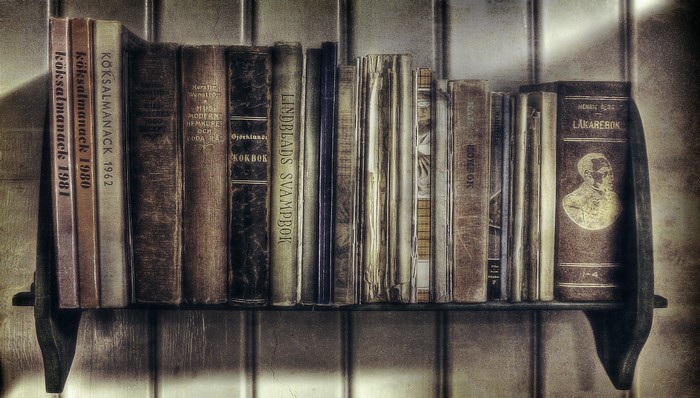 Collection of old books on a shelf