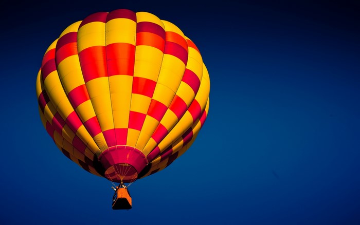Hot air balloon with red and yellow checkered pattern