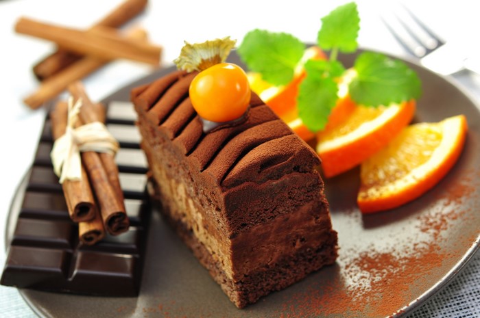 Chocolate cake with cinnamon and orange slices