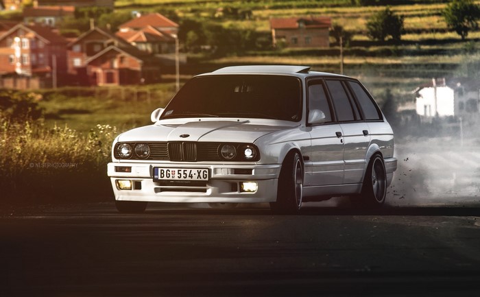 White BMW E30 325 Wagon Drifting