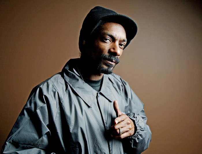 Snoop Dogg wearing a jacket and winter hat