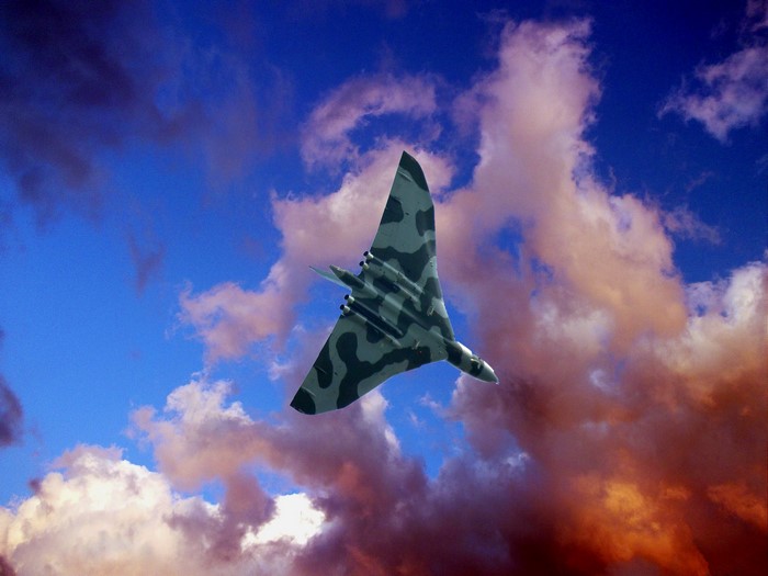Airplane flying in the sky with clouds
