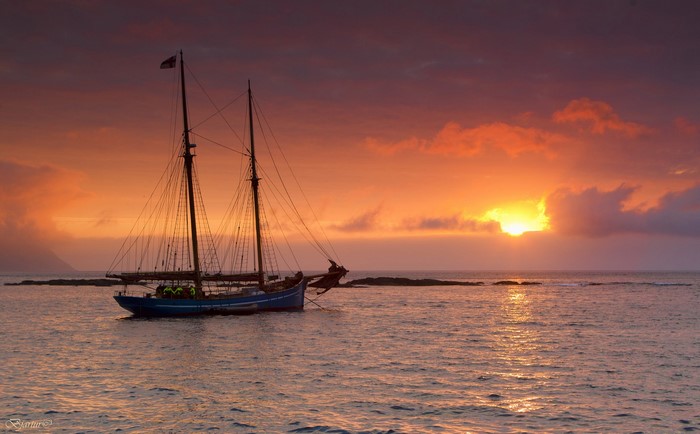 Sailboat at sunset over the sea