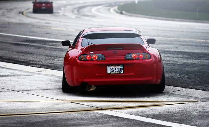 Red Toyota Supra Rear View on Road