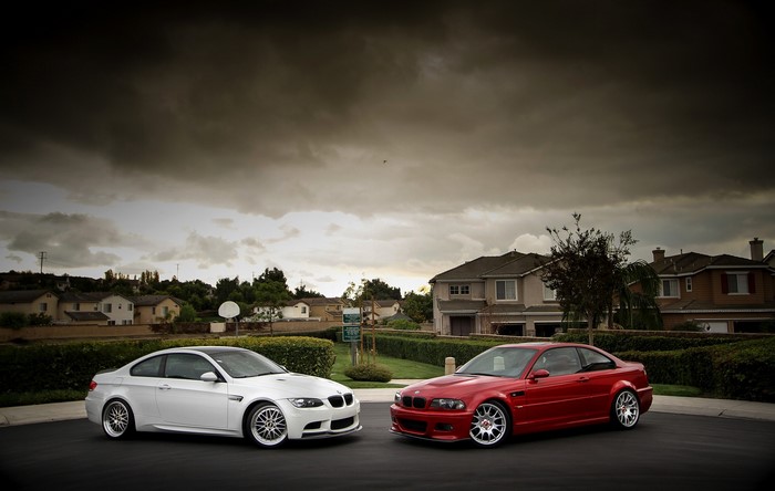 Two BMW M3 E92 cars parked on a street