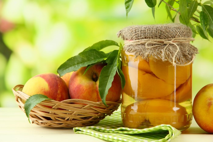 Peaches in a jar and basket