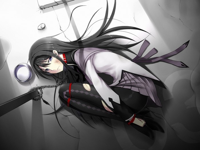 Brunette girl chained on the ground