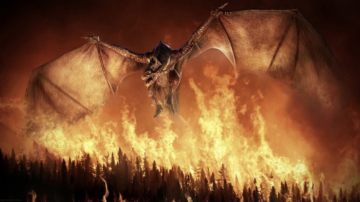 Dragon flying over a forest fire