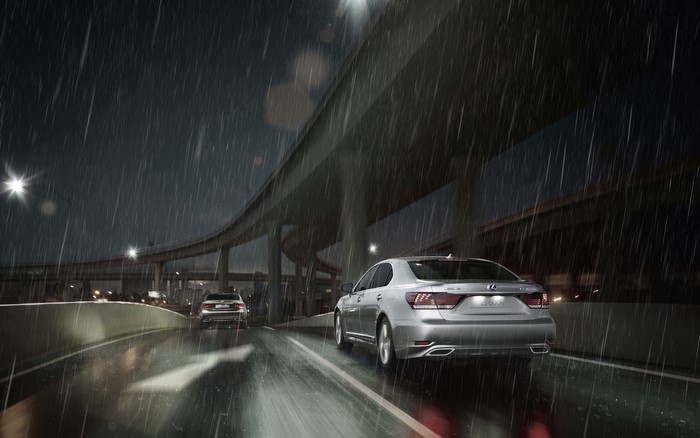 Lexus LS-EU driving on a highway at night in the rain