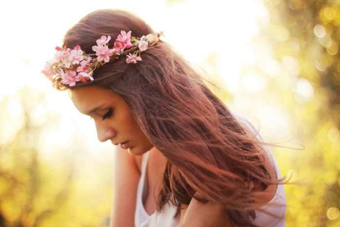 Woman with flower crown in golden light