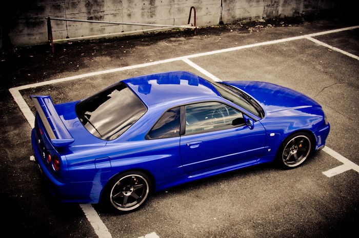 Blue Nissan Skyline GT-R R34 in Parking Lot