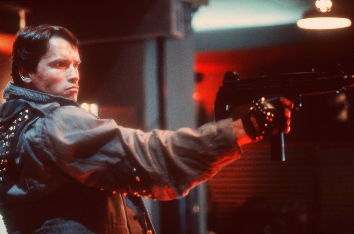 Arnold Schwarzenegger as The Terminator with assault rifle