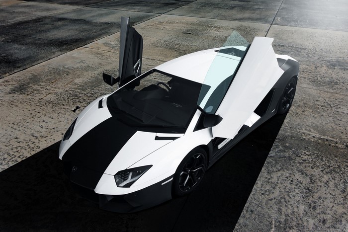 White Lamborghini Aventador with black stripe and opened doors