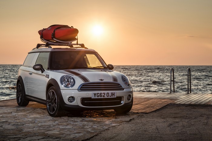 White Mini Clubvan Cooper Camper with Kayak on Roof