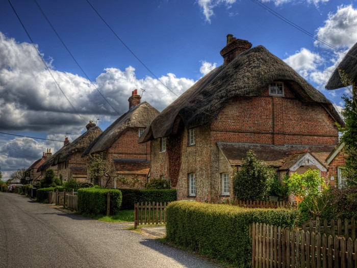 Thatched roof cottages on a street in Winchester, Hampshire, England