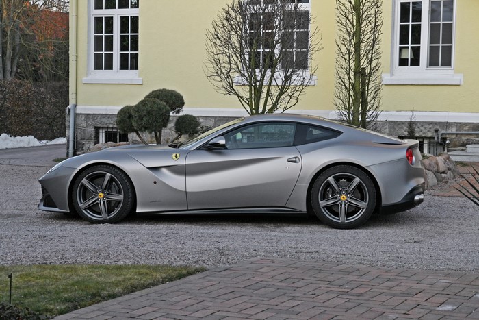 Grey 2013 Ferrari F12berlinetta parked outside a house
