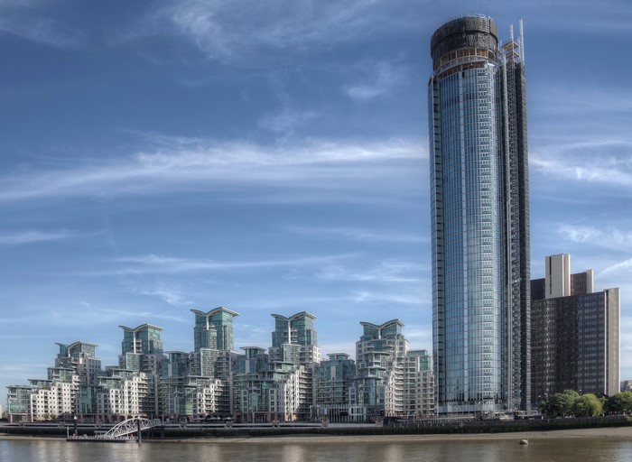 Modern skyscrapers and apartment buildings along the Thames River in London