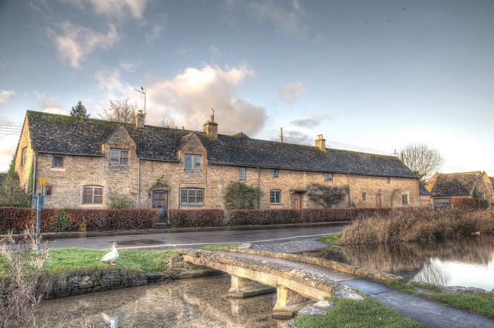 Stone cottages and bridge in Lower Slaughter, England