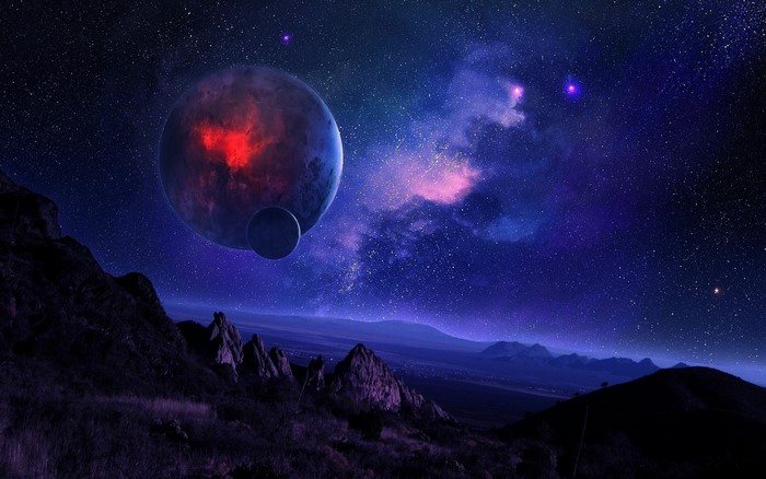 Alien planets and nebulae in a starry sky