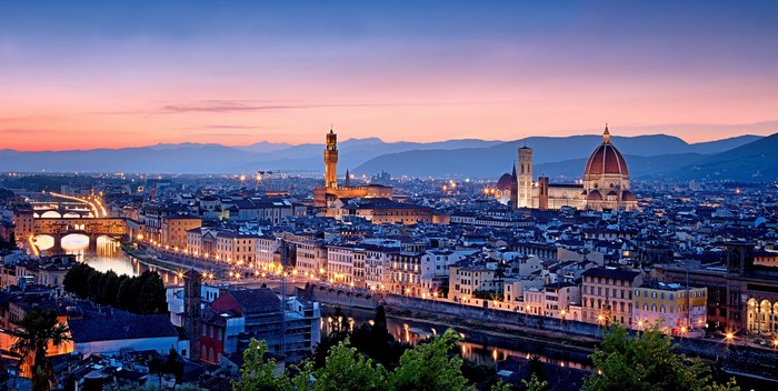Florence cityscape with Arno River and Ponte Vecchio at dusk
