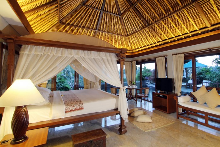 Luxury bedroom with canopy bed and outdoor view