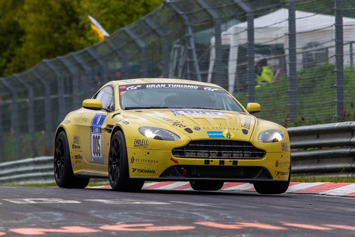 Yellow Aston Martin V12 Vantage N24 on track