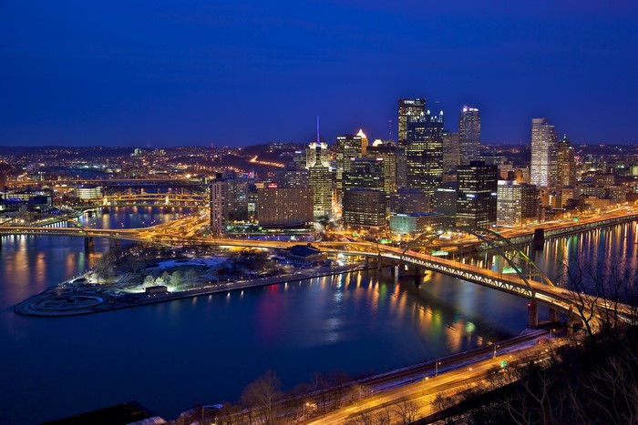 Pittsburgh skyline and rivers at night from above