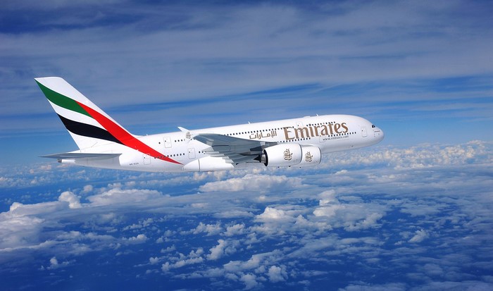 Emirates Airbus A380 flying above clouds