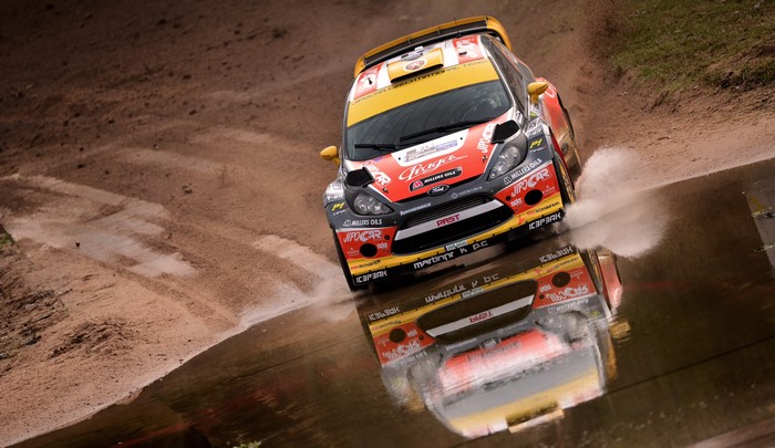 Ford Fiesta rally car driving through water
