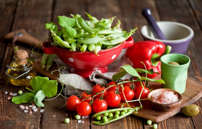 Fresh vegetables and ingredients on a wooden table