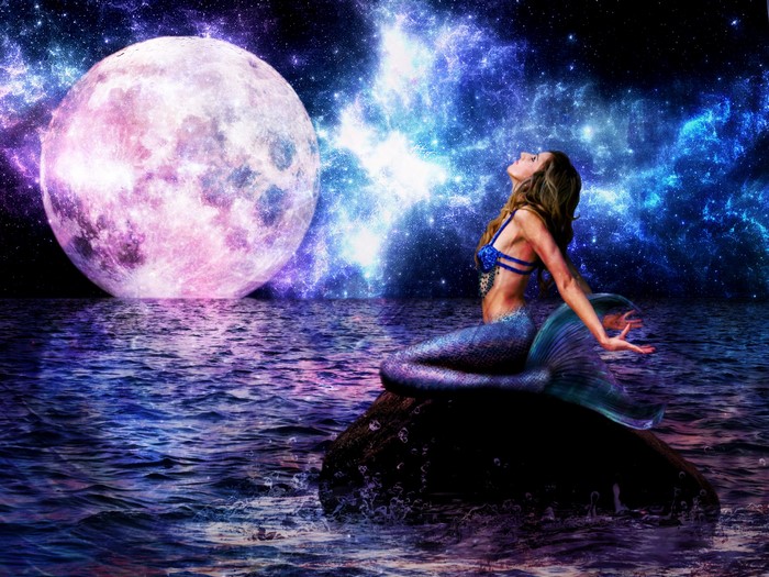 Mermaid sitting on a rock under a large moon and starry sky