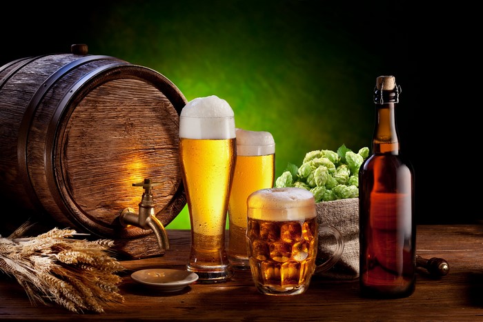 Beer barrel, hops, glasses, and bottle