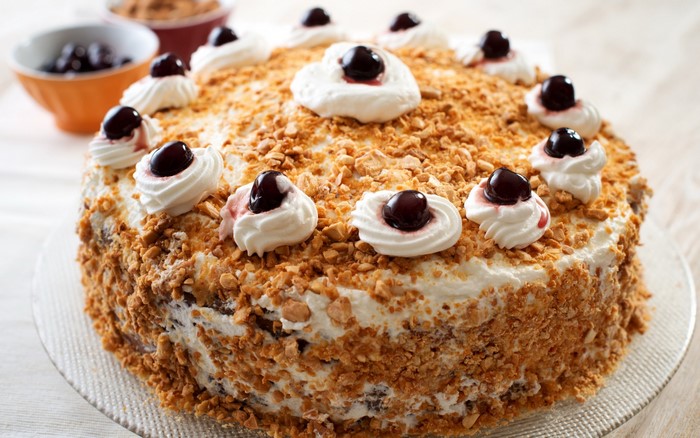 Cake with whipped cream and cherries