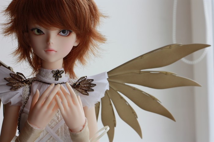 Doll with red hair and wings