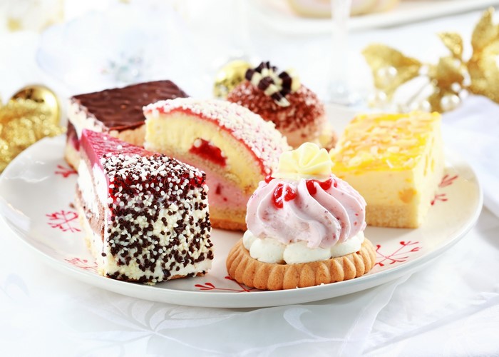 Assortment of small cakes on a decorative plate