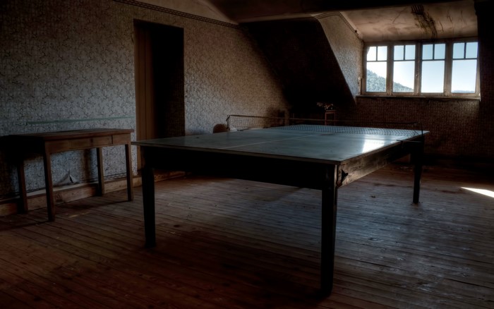 Ping pong table in an abandoned room