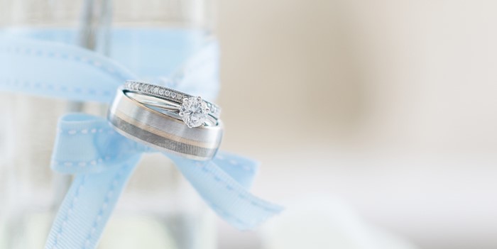 Wedding rings on a blue ribbon