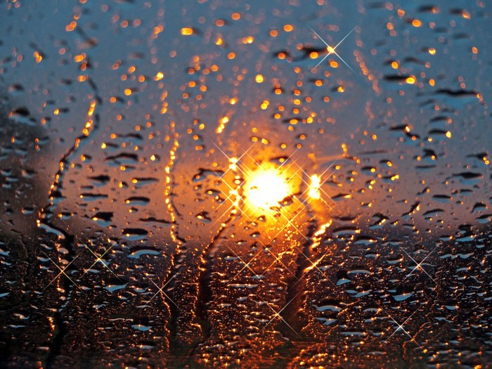 4K wet glass with sunset bokeh