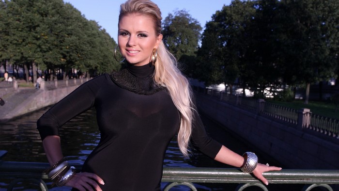 Anna Semenovich posing by a canal