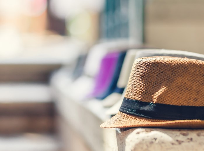 Straw fedora hat with black ribbon