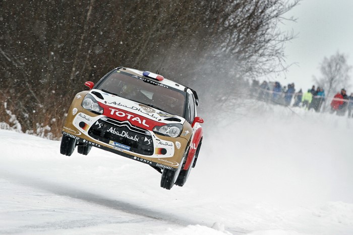 Citroen DS3 rally car in flight during a winter rally