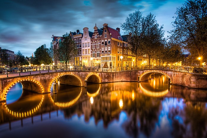 Amsterdam canal bridge at night