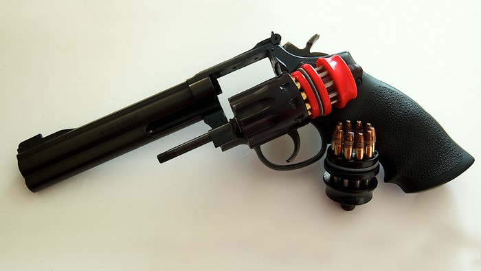 Smith & Wesson Revolver with Speedloader and Ammunition