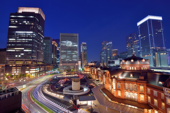 Tokyo cityscape at night with illuminated buildings and traffic