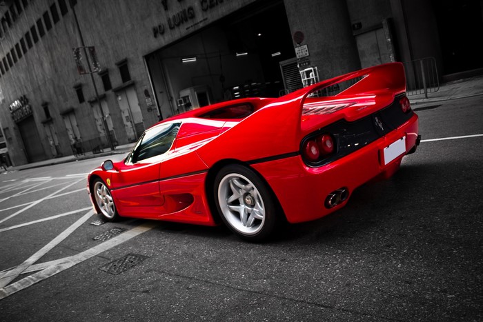 Red Ferrari F50 sports car from behind