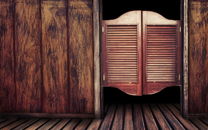Wooden saloon doors and plank walls