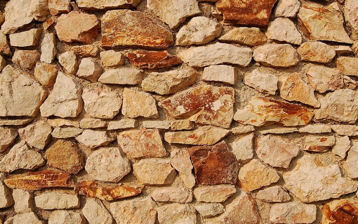 Stone wall texture with many stones