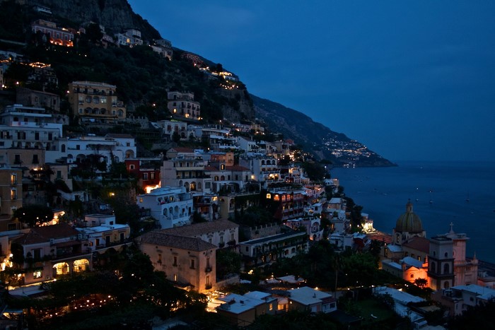Positano, Italy at night with illuminated houses on a mountain