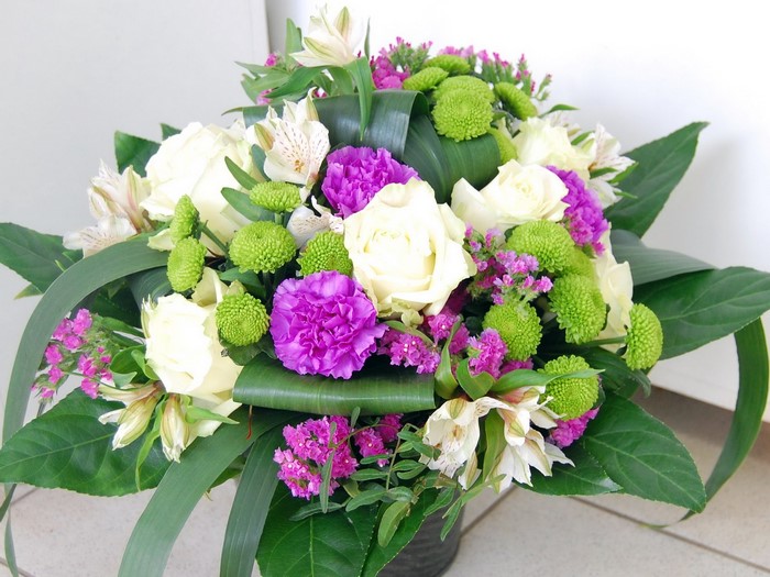 White roses and purple carnations bouquet