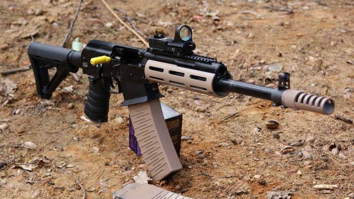 Saiga-12 shotgun with red dot sight and extended magazine